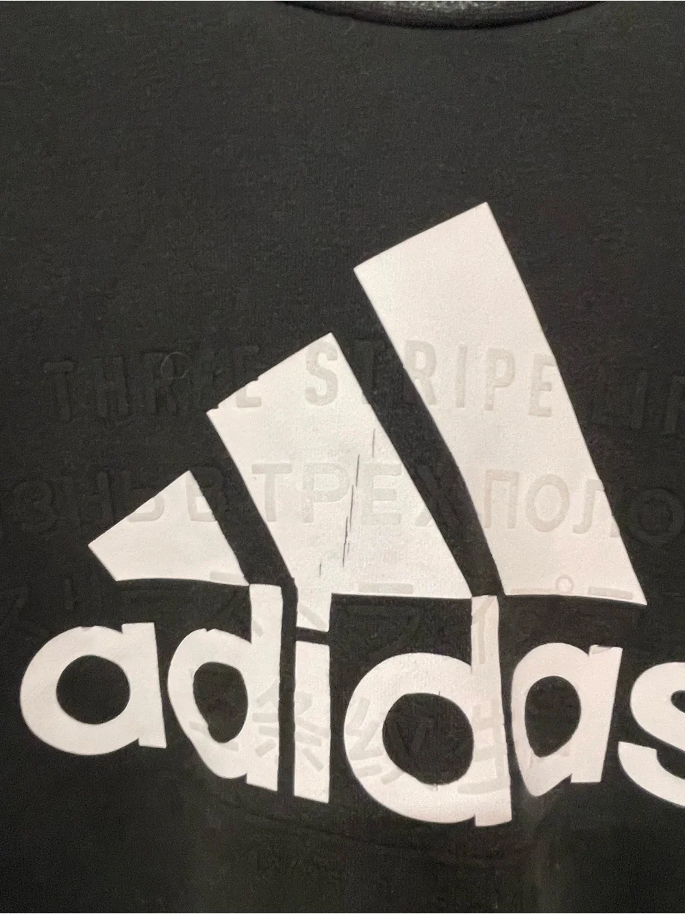 black Adidas crewneck fleece sweatshirt featuring a large white performance